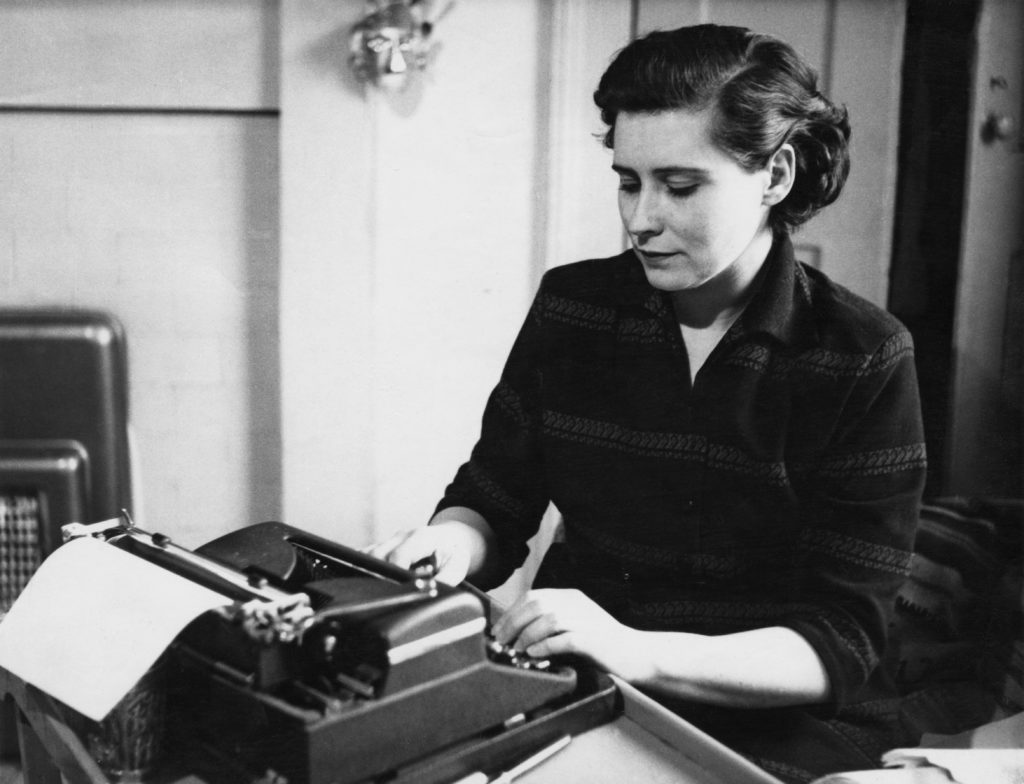 Doris Lessing at a typewriter