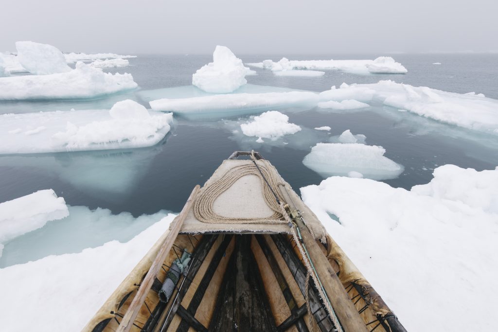 A photograph of a boat in the Arctic